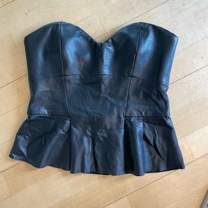 Faux leather peplum bustier with visible zipper